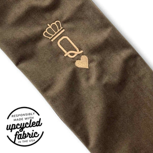 Close-up of the gold embroidered Queen of Hearts icon on reclaimed chocolate brown velour with premium craftsmanship on the Queen of Hearts Original Wand Pouch.