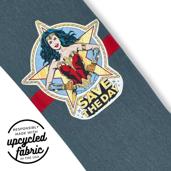 Close-up of the hand-applied superhero appliqué on reclaimed lightweight denim with grosgrain ribbon detail on the Save the Day Original Wand Pouch.
