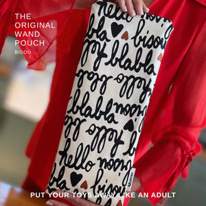 Lifestyle photo of the Bisou Wand Massager storage pouch held by model in red blouse highlighting fabric and size
