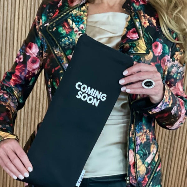 Lifestyle image of Quiver.love Coming Soon discreet storage pouch in black cotton