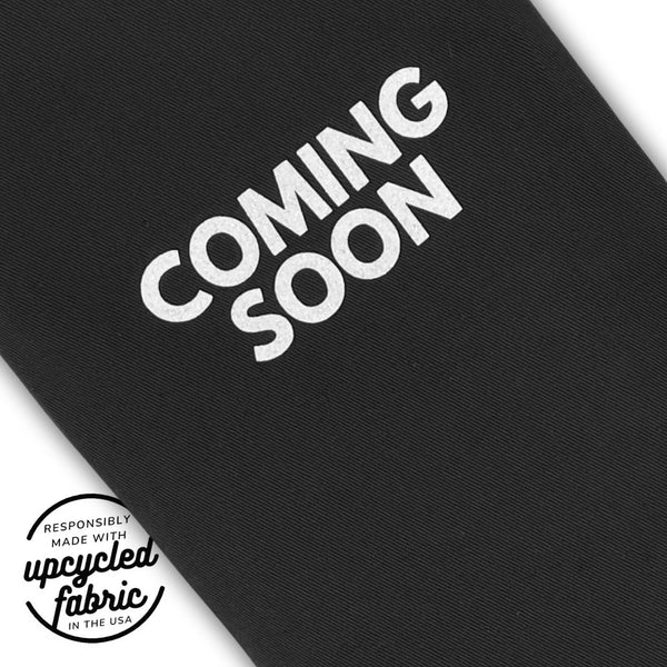 Fabric detail of  travel case for wand-style wellness accessories, handcrafted from reclaimed fabric.