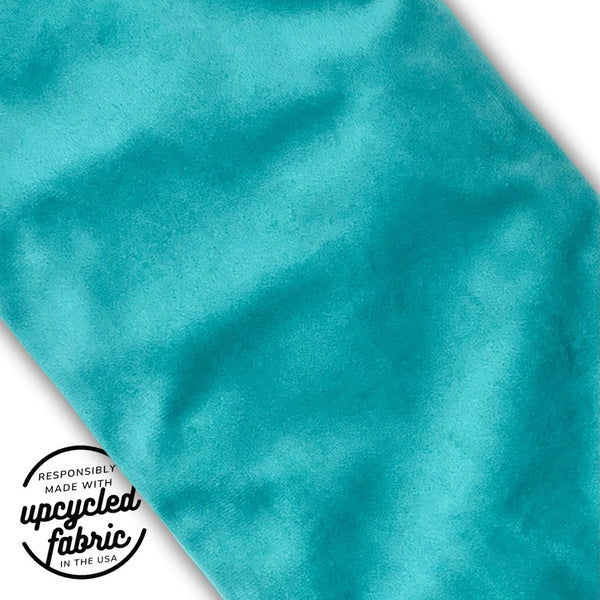 Up close detail of sustainable travel case for wand-style wellness accessories, handcrafted from reclaimed fabric.