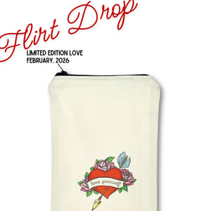 Cream-colored Original Wand Massager pouch with heart and arrow design, featuring 'flirt drop' text on a white background.