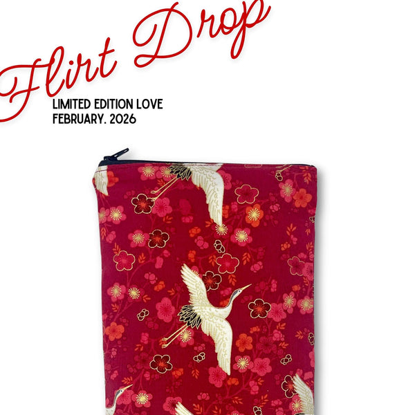 Original Magic Wand Pouch with floral and crane design on a red background, featuring 'flirt drop' valentine day promotion.