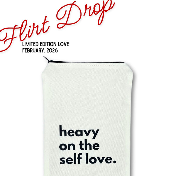 Original Wand  pouch in sturdy white canvas with text 'heavy on the self love' part of the 'flirt drop' valentine promotion shown on a white background