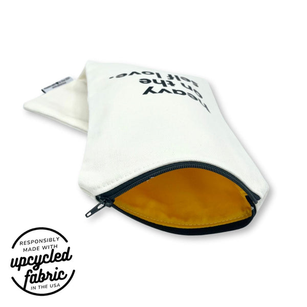 Discreet, zippered case with yellow cotton lining for wellness accessories, made in the USA.


