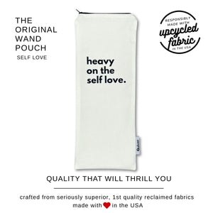 Original Wand Massager puch in White canvas with 'heavy on the self love.' text printed in black.  Branding information indicated made in the USA with 1st quality reclaimed fabrics