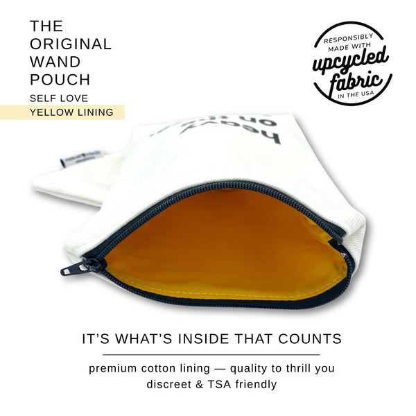 "Heavy on Self Love "Original Wand pouch pictured unzipped to show yellow  lining.