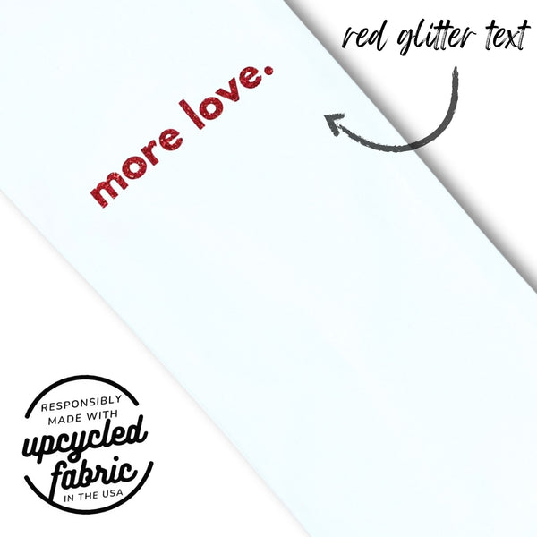 Detail of Magic Wand vibrator bag. Fits hitachi magic wand, massagers and other adult toy.  White denim with More Love in red glitter text