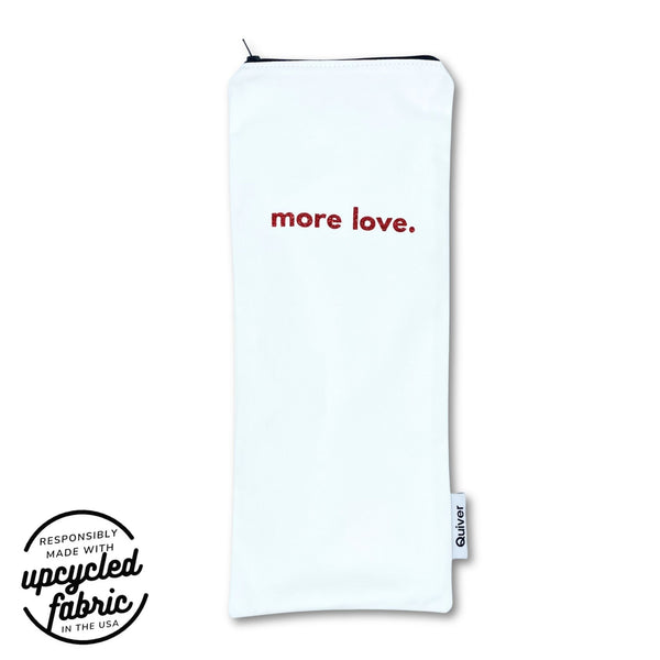 White Original Wand pouch with 'more love.' red glitter ext on a white denim zipper bag, featuring Quiver.love | amde in the USA branding.