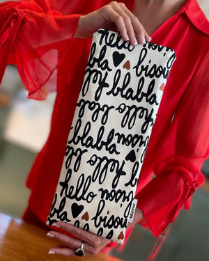 Storage bag for wand massager. Fits Hitachi Magic wand, personal massager or other adult toy.   Made of couture 1st quality fabric reclaimed from French Design house. Zipper closure, fully lined. Fabric is decorated with the words “bisou, hello and bla bla” in black script. USA made buy Quiver.love