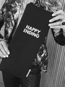 Product demo of The Happy Ending Wand Pouch illustrating discreet, sustainable storage for full-size handheld devices.  USA made of reclaimed black cotton fabric, TSA friendly travel case