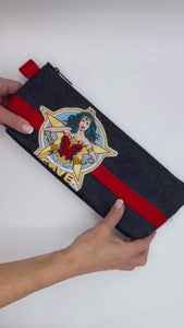 adult toy zipper bag with wonder woman applique.  Made in the usa with reclaimed denim.