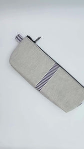 storage case , travel bag for vibrator, adult toy or personal massager.  made in the usa of natural colored denim with black and white ribbon details
