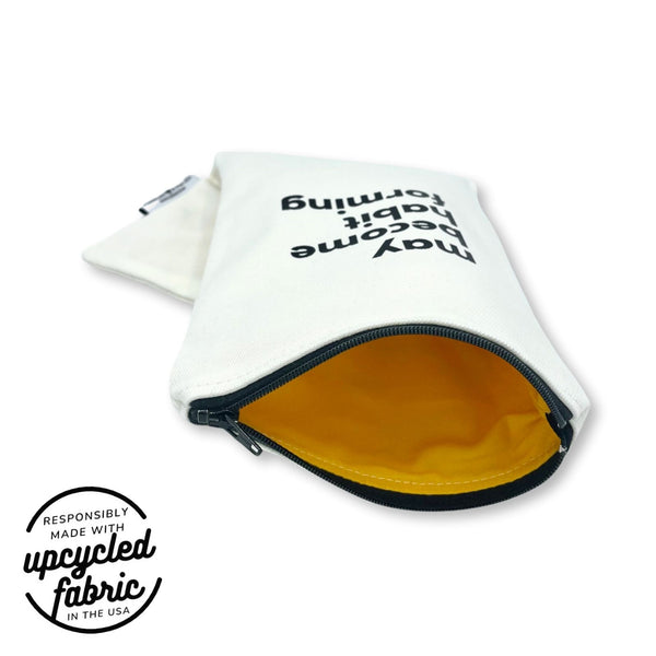 Wand pouch with “Heavy on the Self-Love” text printed on off-white denim.
Discreet, zippered case with yellow cotton lining 