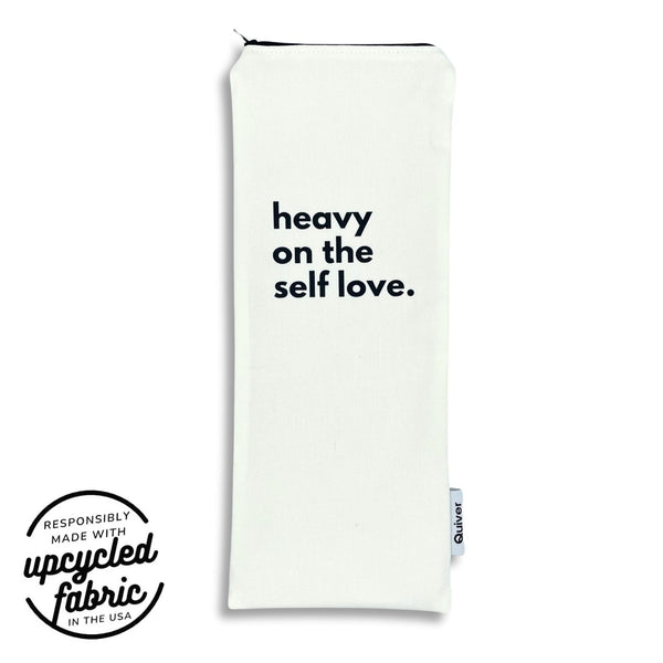 Wand pouch with “Heavy on the Self-Love” text printed on off-white denim.