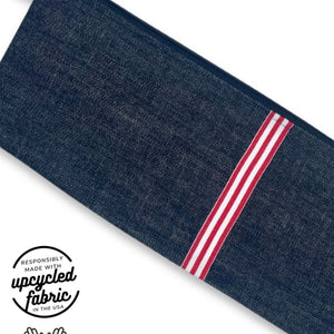 Fabric detail of sex toy pouch in midnight denim fabric with red and white ribbon accent, made in USA by Quiver.Love