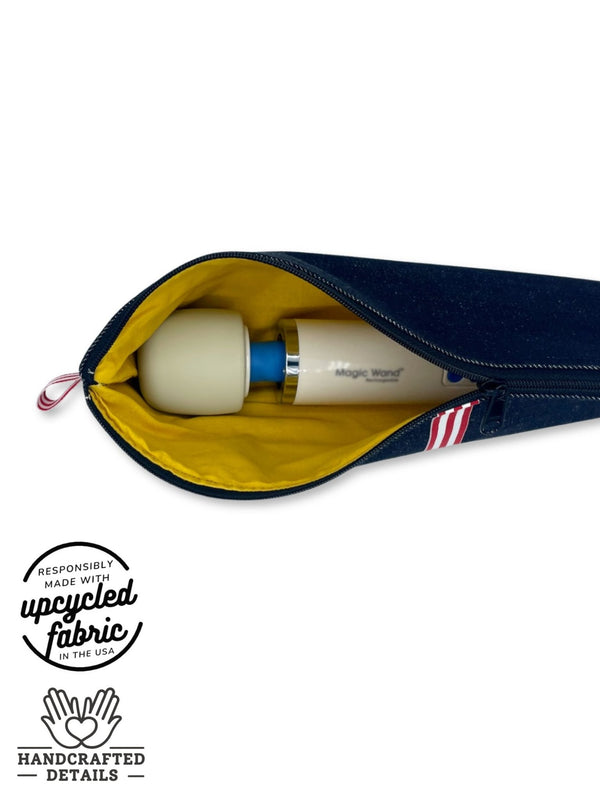 fit detail of wand massager, sex toy storage bag in dark blue denim fabric, shown holding hitachi magic wand