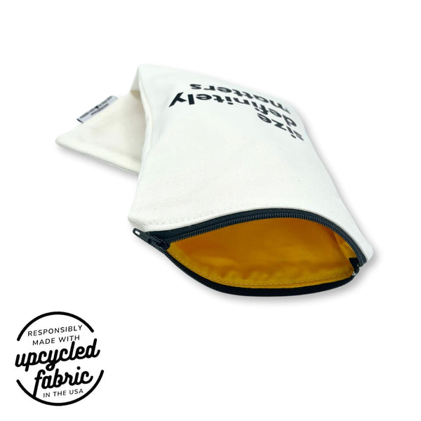Discreet zippered case with yellow cotton lining for wellness accessories.